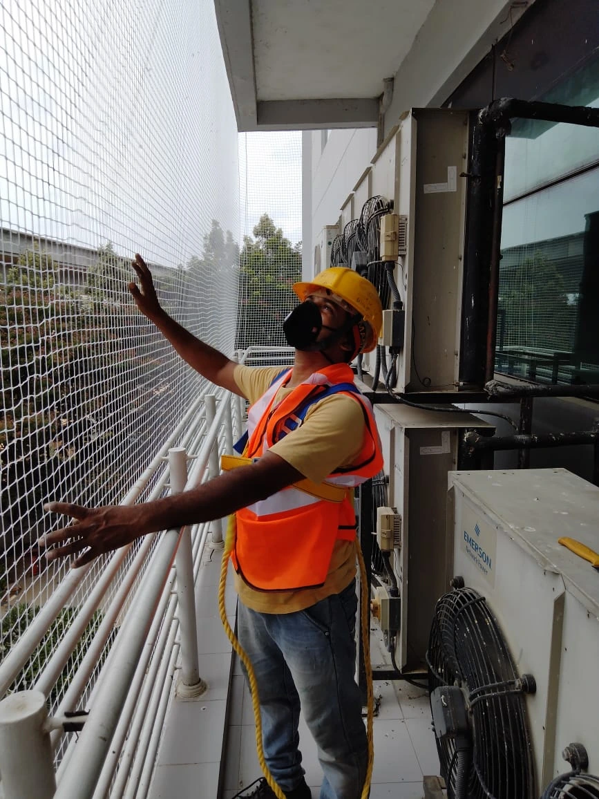 Netting Experts team installing safety nets
